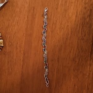 Homemade beaded silver and rainbow colour bracelet